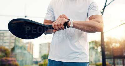 Buy stock photo Hands, smart watch and padel with fitness, click and check stats for training, results or heart rate. Person, athlete and iot wristwatch for sport, racket and monitor in city at tennis court for game