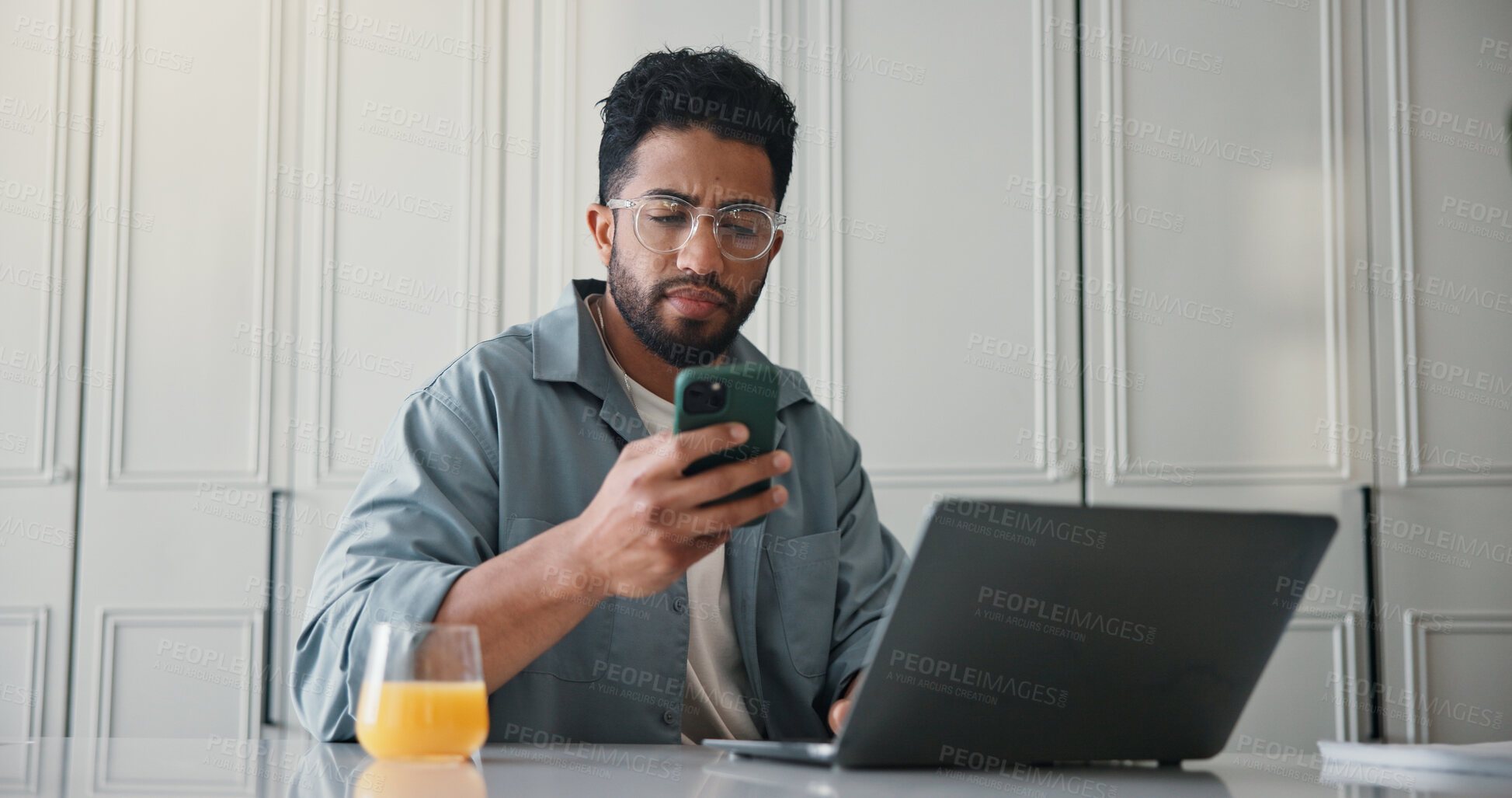 Buy stock photo Remote work from home, laptop and man with cellphone, internet and online reading with copywriting. Apartment, person and writer with pc, smartphone and message to contact, app and email notification