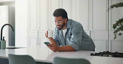 Buy stock photo Phone, coffee and man in kitchen in home with networking, communication or social media on mobile app. Tea, technology and male person with cellphone for contact, texting or chatting in apartment.