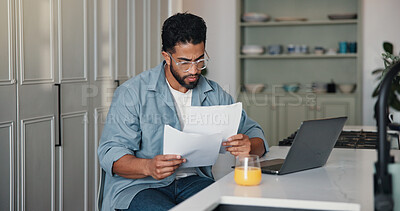 Buy stock photo Reading, paperwork and man with laptop, home and writer with royalty statement or financial analysis. Creative, author and person with documents for self employment, remote work and tax preparation