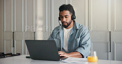 Buy stock photo Headset, laptop and remote work with man in kitchen of home for startup planning or research. Computer, small business and typing with freelance employee at counter in apartment for online feedback