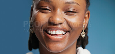 Buy stock photo Portrait, black woman and smile for dental in studio for teeth whitening, oral care and hygiene. Banner, female person and confident for fresh breath, happiness and veneers results on blue background