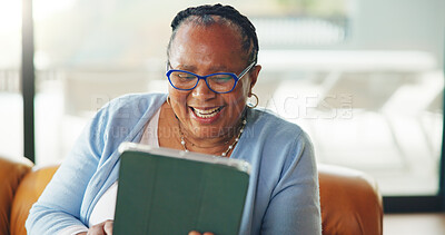 Buy stock photo African old woman, smile and tablet at house for ebook, browsing social media and funny video. Happy, senior person and laughing with digital, streaming and download games of retirement entertainment
