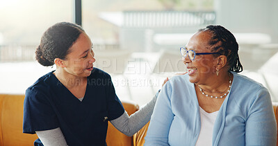 Buy stock photo Laughing, old woman and caregiver in nursing home with funny story, conversation or wellness checkup. Smile, senior person or nurse in retirement center with joke, communication or healthcare support