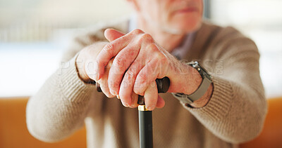 Buy stock photo Senior man, hands and cane in home for balance, retirement and support for arthritis patient. Walking stick, mobility aid and person with disability from injury, assistance and osteoporosis care