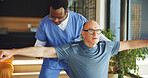 Support, physiotherapist and stretching with old man in office for help, chiropractor and rehabilitation. Consulting, physical therapy and recovery with senior patient in clinic for healthcare