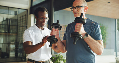 Buy stock photo Fitness, physiotherapy and weightlifting with people in clinic for health, recovery or wellness. Dumbbells, exercise or rehabilitation with mature patient and therapist in office for medical support