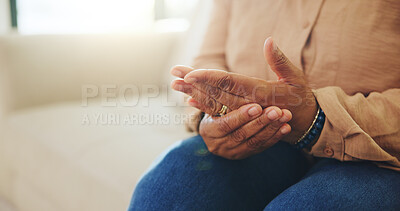 Buy stock photo Home, person and hands with pain, arthritis and massage for injury relief with medical health risk. Fingers, sore joint and woman with fibromyalgia, osteoporosis or inflammation in living room