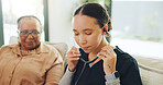 Assisted living, healthcare or stethoscope with nurse and old woman on sofa in home for checkup. Appointment, cardiology or medical with caregiver and senior patient in apartment for consulting
