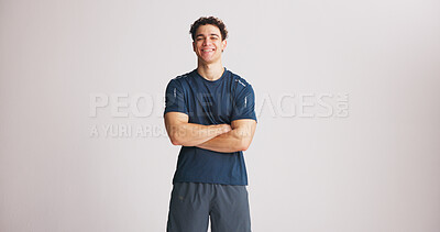 Buy stock photo Portrait, athlete and man with arms crossed in studio for fitness, exercise pride and healthy body. Mockup space, bodybuilder and confidence for training, sportswear and happiness on white background