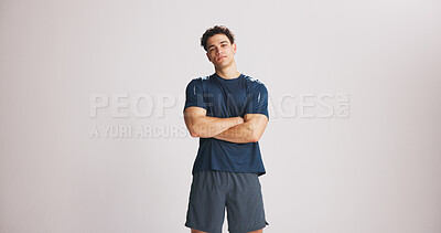 Buy stock photo Portrait, fitness and man with arms crossed in studio for strength, exercise pride and healthy body. Mockup space, bodybuilder and confidence for training, growth and wellness on white background