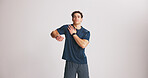 Fitness, portrait and stretching with man on studio space for start of training or workout routine. Exercise, shoulder and warm up with athlete on gray background mockup for challenge or performance