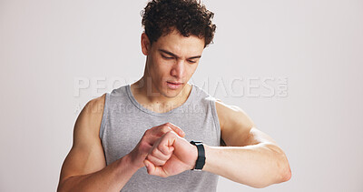 Buy stock photo Man, scroll or smart watch in studio for fitness, tracking heart rate or exercise progress app. Active, person or check tech with workout results, wellness or monitor step counter on white background