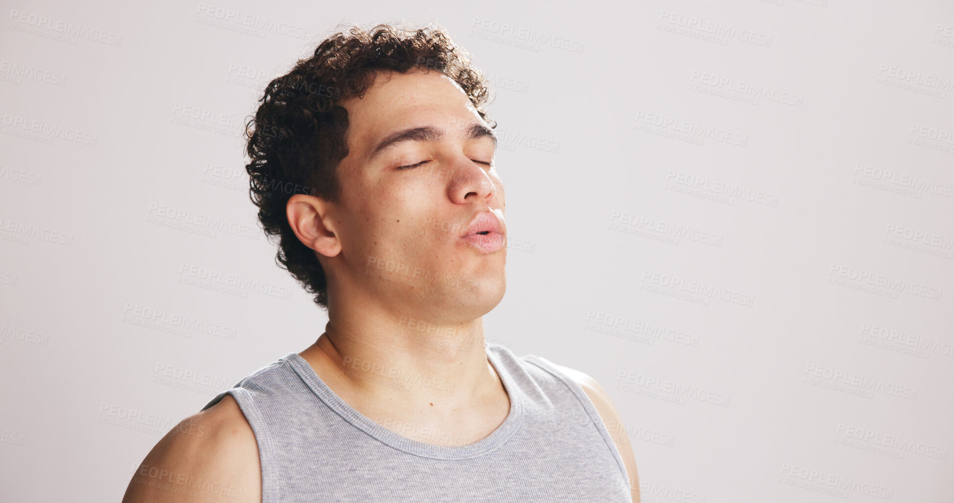 Buy stock photo Break, breathing and fitness with man on studio space for recovery from training or workout. Exercise, fatigue and inhale with tired athlete on white background mockup for challenge or performance