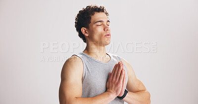 Buy stock photo Yoga, man and prayer hands in studio with breathing for meditation, spiritual awareness or wellness. Zen, space and person on white background with mudra for breathwork, mindfulness and namaste pose.