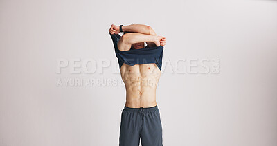 Buy stock photo Fitness, remove tshirt and six pack with man on studio space for training results. Abs, health and wellness with body of athlete person on white background mockup to take off clothes or undress