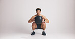 Fitness, medicine ball and portrait of man on studio space for weight training or workout. Exercise, heavy and squat with serious athlete on white background mockup for challenge or performance