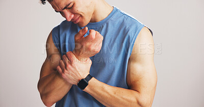 Buy stock photo Fitness, man or wrist pain in studio from workout challenge, sports injury or bodybuilding accident. Hurt, person and athlete with joint inflammation, arthritis relief or massage on white background.