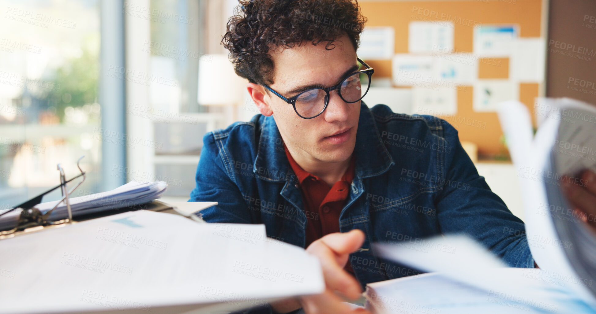 Buy stock photo Multitask, stack or man in office with document, task or deadline pressure in management review. Busy, organize or marketing intern in agency with glasses, paper check or crisis control in time limit