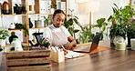 Clipboard, laptop and black woman in office with information for sustainable or eco friendly startup. Computer, female person and African nursery manager writing notes for plants sales in workplace.