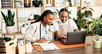 Smile, black women and florist with laptop for startup with online order, inventory and check stock. People, teamwork and reading reviews on pc, ecommerce report and information for floral delivery