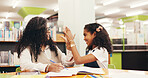 High five, education and teacher with child in library for studying, learning or tutoring at school. Happy, book and educator with girl student for celebration with correct answer at academy. 