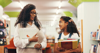 Buy stock photo Books, child and teacher talking in library with tutoring feedback, learning support and education. Happy, tutor or student with conversation at school for exam preparation, lesson discussion or chat