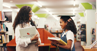 Buy stock photo Books, teacher and girl in library, talking and education with happiness, learning and support. Feedback, funny and woman with kid, child development and knowledge with tutor, advice or discussion