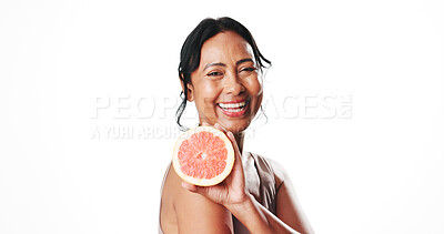Buy stock photo Portrait, skincare and mature woman with grapefruit, mockup space or facial treatment with vitamin c. White background, natural cosmetics and anti aging benefits for person, happy and dermatology