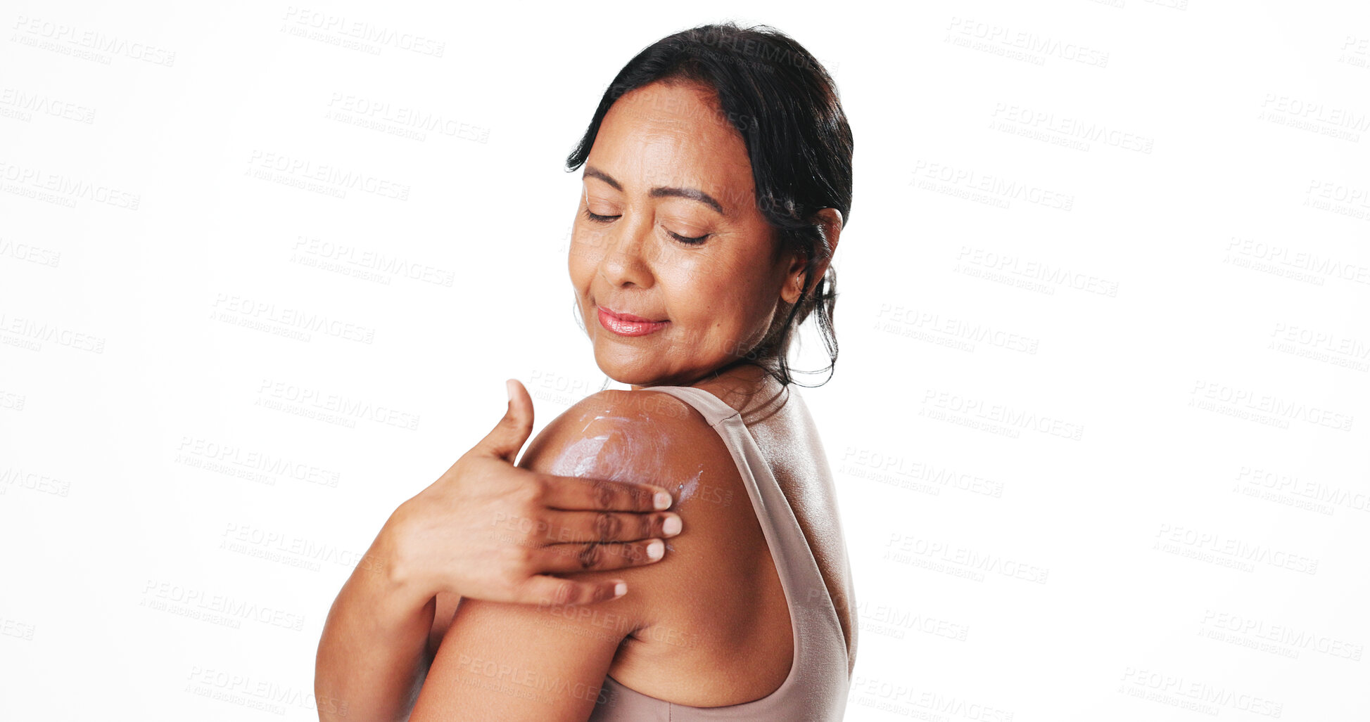 Buy stock photo Mature, happy woman or skincare with sunscreen in studio for SPF on a white background. Female person, model or smile with lotion, UV protection or moisturizer for smooth skin or dermatology on space