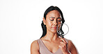 Magnifying glass, skincare and mature woman in studio for beauty inspection, self care results and lens tool. Dermatology investigation, anti aging focus and glow with person on white background