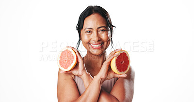 Buy stock photo Skincare, portrait and woman with grapefruit, self care and facial treatment with vitamin c and glow. White background, natural cosmetics and mature person with fruit, anti aging benefits and studio