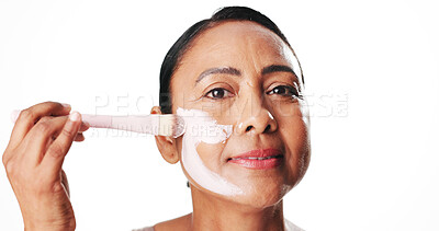 Buy stock photo Woman, beauty and face mask with brush for skincare or cosmetics on a white studio background. Portrait, female person or model with smile, tool or facial for dermatology, cleansing or anti aging