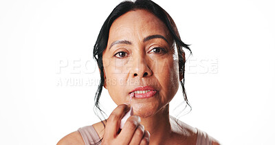 Buy stock photo Beauty, portrait and woman with lip gloss in studio for hydration, natural aesthetic and benefits. Mockup space, mature person and apply product for moisturizer and SPF protection on white background