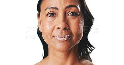 Buy stock photo Portrait, scrub and lips of mature woman in studio for skincare, exfoliation or hydration for grooming. Mockup space, white background and person with cosmetics for beauty, anti aging and circulation