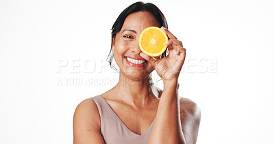 Buy stock photo Portrait, skincare and mature woman with orange, mockup space or facial treatment with antioxidants. White background, natural cosmetics and fruit with vitamin c, anti aging and self care in studio