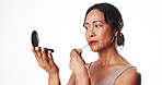 Woman, lipstick and mirror in studio for beauty, makeup and mock up space on white background. Mature person, cosmetics and product with tools, lip gloss and application for mouth with cosmetology