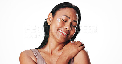 Buy stock photo Woman, skincare cream and smile in studio with eyes closed, glow or mockup space on white background. Mature person, happy and application for moisturizer, lotion and collagen benefits for anti aging