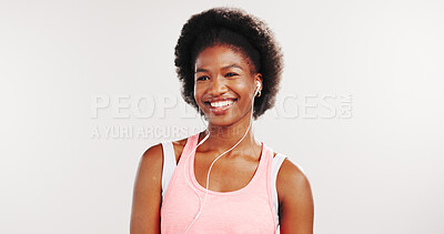 Buy stock photo Music, fitness and smile with black woman in studio for streaming service, workout playlist and health. Radio subscription, exercise podcast and earphones with person on white background for audio