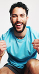 Man, fitness and fist pump in studio portrait, smile and excited for goals on white background. Person, athlete and happy with success, achievement and confidence for training routine in Colombia