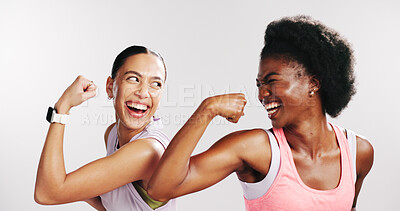 Buy stock photo Fitness, friends or laugh with muscle flex in studio for bicep development, workout goals or support. Progress, athletes and excited women with strong arms on white background for exercise results