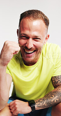 Buy stock photo Happy man, fitness and fist pump in studio portrait, excited or goal with pride on white background. Person, athlete and smile for success, sports achievement and celebration for wellness in Germany