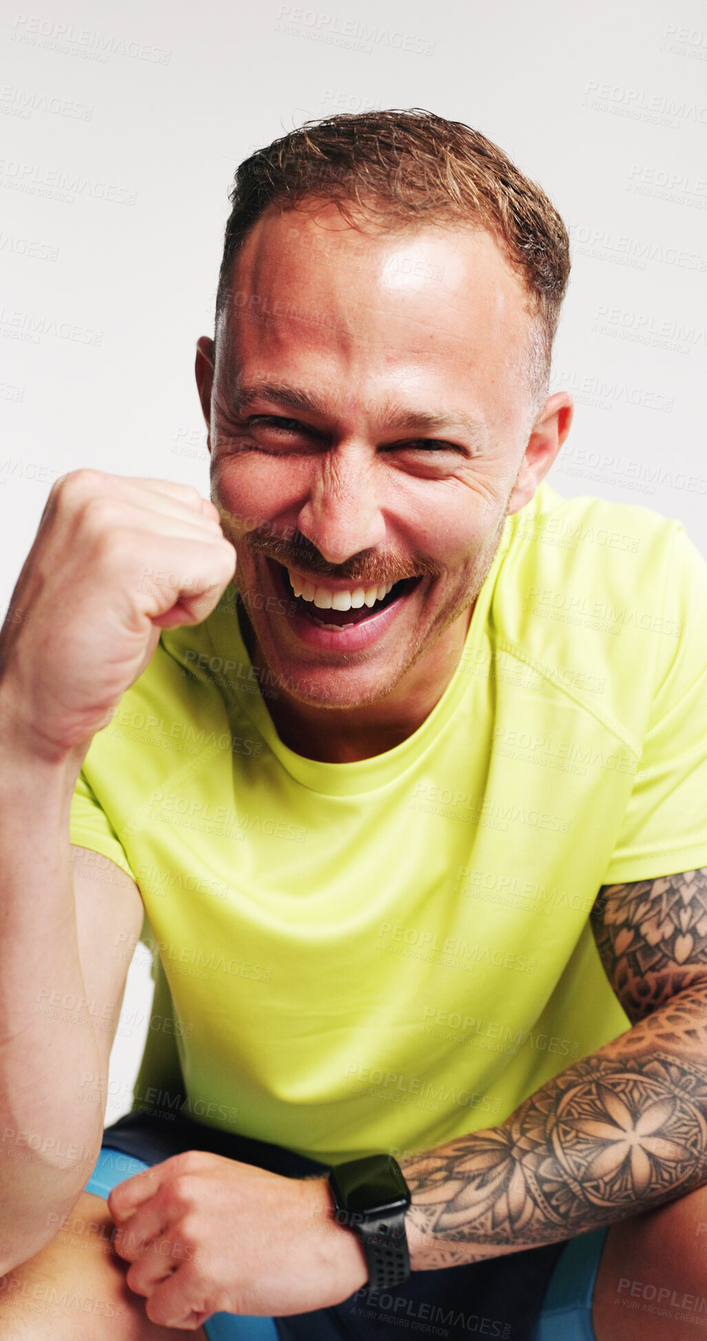 Buy stock photo Happy man, fitness and fist pump in studio portrait, excited or goal with pride on white background. Person, athlete and smile for success, sports achievement and celebration for wellness in Germany