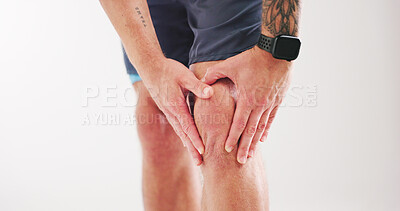 Buy stock photo Fitness, knee pain and accident with man in studio for workout injury, inflammation or fibromyalgia. Exercise mistake, training burnout and leg sprain with person on white background for tension