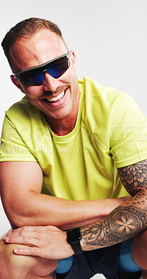 Buy stock photo Fitness, fashion and man with sport sunglasses, studio or happiness with goggles for UV protection. White background, glare reduction and person with blue tint eyewear and visual shield for eye care