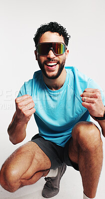 Buy stock photo Fitness, fashion and man with sunglasses, excited or fist pump for win, happy or aesthetic in studio. White background, success or person with shield eyewear, athleisure and athlete with hand gesture