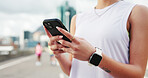 Hands, fitness and woman in city, smartphone and message to contact, exercise and chatting. Outdoor, person and athlete in street, cellphone and typing with digital app to track progress and internet