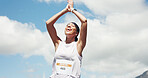 Runner, applause or happy woman with marathon race, cardio exercise or celebrate achievement. Low angle, finish event or athlete with resilience challenge success, outdoor space or clap for winning