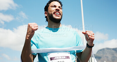 Buy stock photo Man, marathon and celebration with ribbon at finish line with low angle, goals and winning performance. Person, champion and happy runner with achievement, success and fist pump for sports milestone