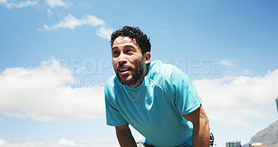 Buy stock photo Runner, fitness and man in city for rest, recovery and break for exercise, workout and training. Sports, athlete and person with fatigue, tired and health in town for marathon, wellness or running
